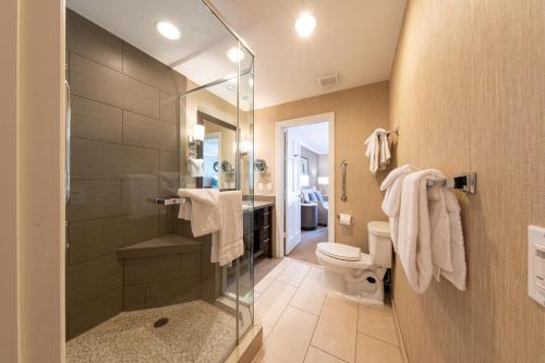 a bathroom with a shower and a toilet at Carlsbad Inn Beach Resort in Carlsbad