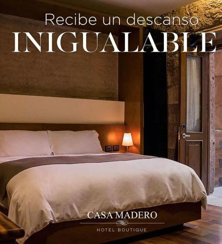 a poster of a bed in a hotel room at Hotel Boutique Casa Madero in Morelia