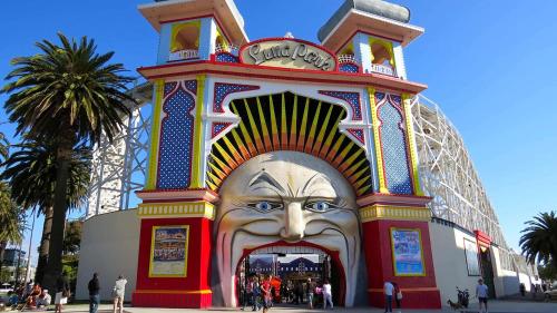 a large mural of a face in front of a building at Saint Kilda Beach Hotel - formerly Rydges St Kilda in Melbourne