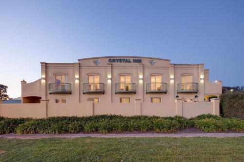 a building with lights on the front of it at Best Western Crystal Inn in Bendigo