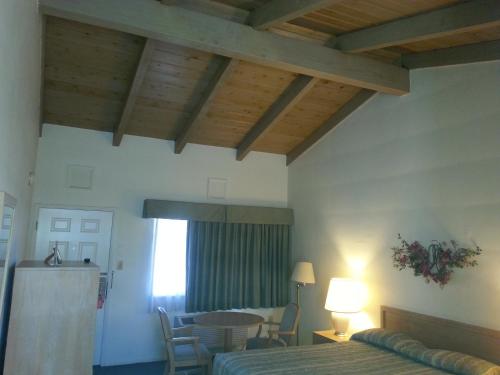 Ένα ή περισσότερα κρεβάτια σε δωμάτιο στο Villa Motel