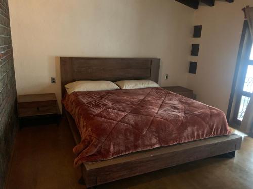 Cama o camas de una habitación en Loftmetepec55