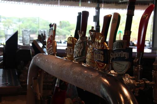 a group of bottles of beer sitting on a bar at Riverview Tavern in Ross River