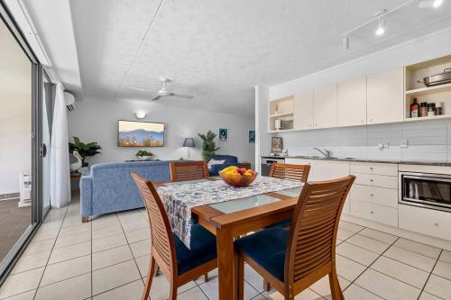 a kitchen and dining room with a table and chairs at Your place. Enjoy the beach retreat in Rainbow Beach