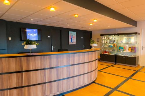 a lobby of a hotel with a reception counter at Kyriad Quimper - Pont-l'Abbé in Pont-lʼAbbé