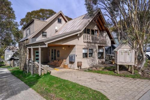a large house with a gambrel roof at Croajingalong in Dinner Plain