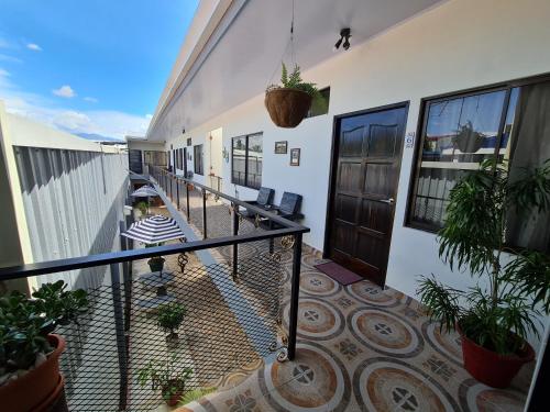 a balcony of a house with plants on it at Apartamentos Ave del Paraíso in Alajuela City