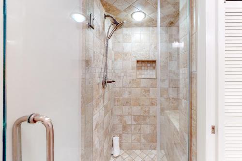 a bathroom with a shower with a glass door at Seascape Garden Villas 18B in Destin