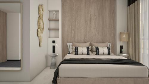 a bedroom with a large bed and a mirror at M. HOTEL in San Antonio