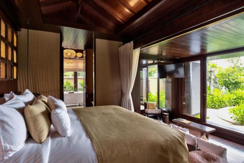 Tempat tidur dalam kamar di The Spa Resorts - Lamai Beach