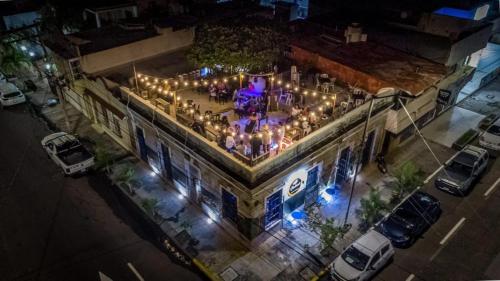 an overhead view of a building with a party on it at night at Chuchumbé Hotel & Hostal in Veracruz