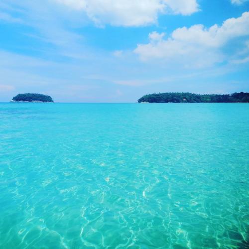 a view of the ocean with two islands in the water at Thalassa Kata Beach in Kata Beach