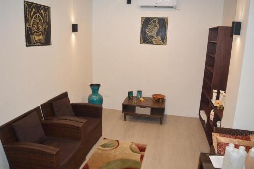 a living room with a couch and a table at Lander's Bay Resort in Lautoka