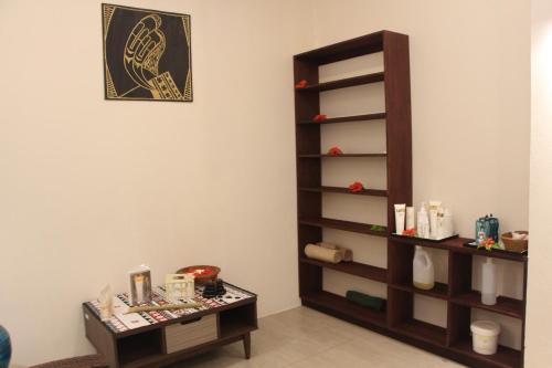 a room with a shelf and a clock on the wall at Lander's Bay Resort in Lautoka