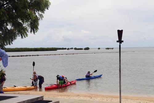 a group of people in a canoe on the water at Lander's Bay Resort in Lautoka