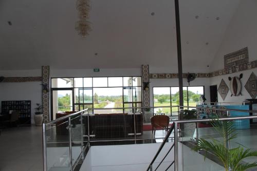 a large room with a lobby with windows at Lander's Bay Resort in Lautoka