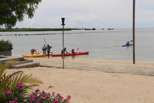 a group of people in kayaks on the water at Lander's Bay Resort in Lautoka