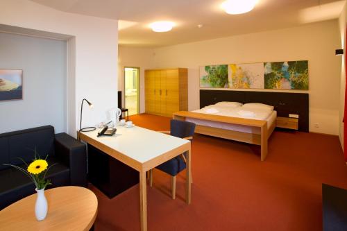 מיטה או מיטות בחדר ב-Hotel Purkmistr