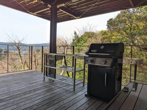 a grill on a deck with a view at VILLA HAKONE湖空 in Hakone
