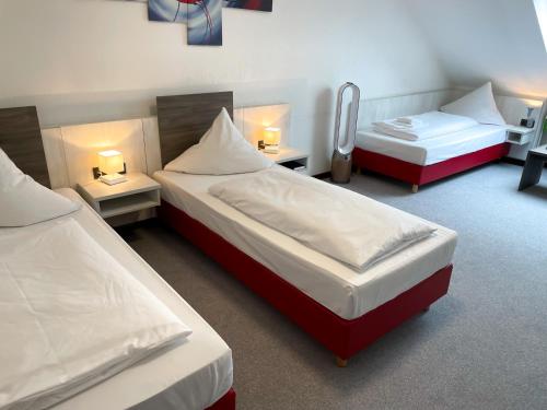 Ένα ή περισσότερα κρεβάτια σε δωμάτιο στο Brenner Hotel