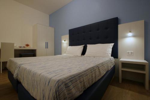 מיטה או מיטות בחדר ב-residence villa Frio Frio