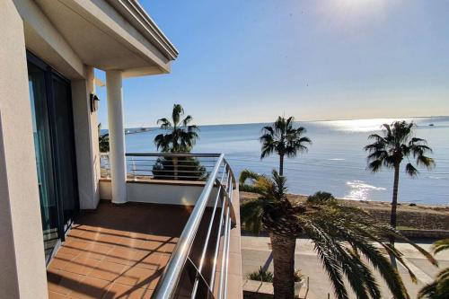 a balcony of a house with a view of the ocean at Miami Mar - Boutique Hotel & Restaurante in Sant Carles de la Ràpita