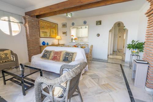A bed or beds in a room at Real View Beach Front