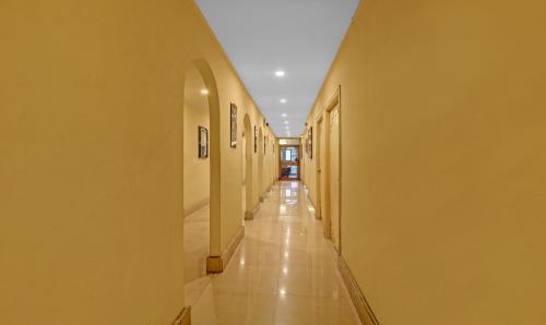 a hallway of a building with a long corridor at Treebo Mira Inn, Camac Street in Kolkata