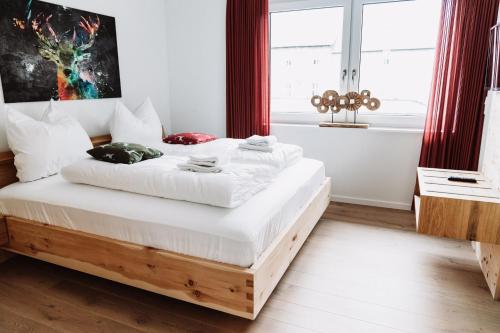 a bedroom with a large bed with a wooden frame at My Lodge Winterberg in Winterberg
