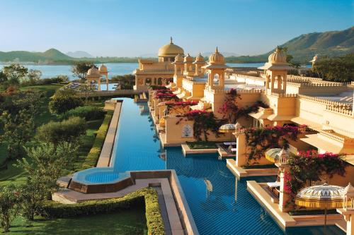 an aerial view of a resort with a swimming pool at The Oberoi Udaivilas Udaipur in Udaipur