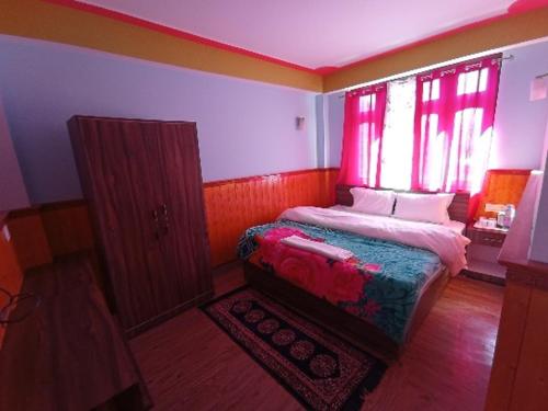 Cama o camas de una habitación en Tseten's Inn