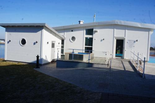 a white building with a ramp leading to the door at Best Western Hotel Corallen in Oskarshamn