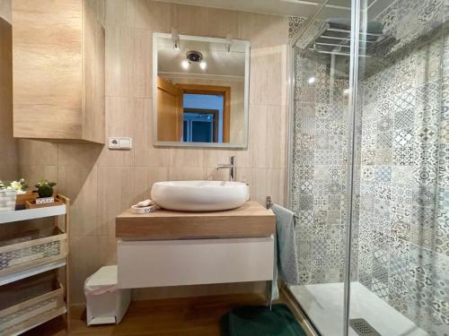 a bathroom with a sink and a shower at Gerona Dream in Benidorm