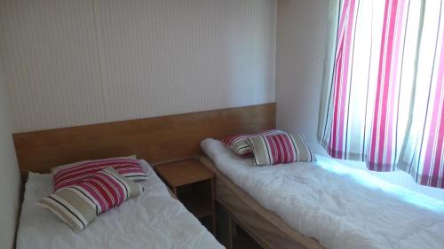 Postel nebo postele na pokoji v ubytování Mobilhome 1 calme et tranquilité