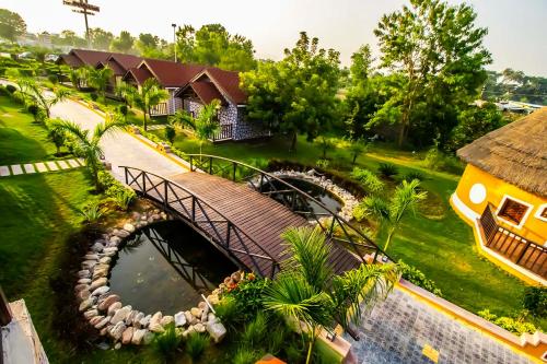 an aerial view of a resort with a bridge over a river at Sun Hotel and Resort, Mount Abu in Ābu Road