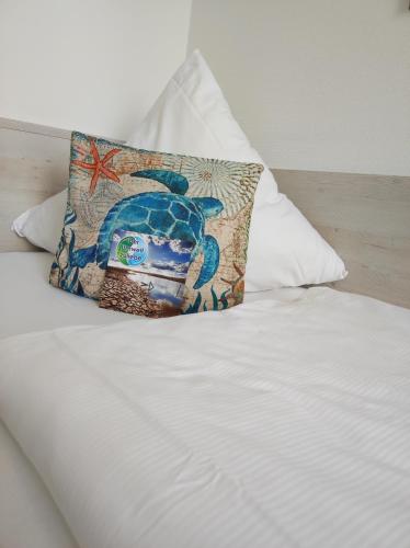 Nordsee Hotel Borkumにあるベッド