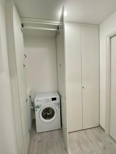 a laundry room with a washing machine in it at Torino Reale in Turin
