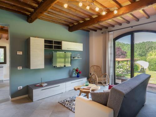 a living room with a couch and a table at Holiday Home Il Fienile del Casolare by Interhome in Penna