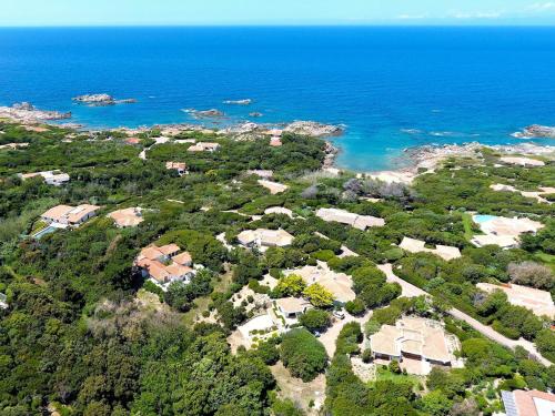 an aerial view of a house near the ocean at Holiday Home Canayli by Interhome in Aglientu