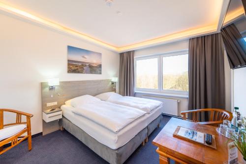 Postel nebo postele na pokoji v ubytování Hotel Mukran