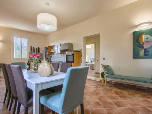 a kitchen and dining room with a table and chairs at Holiday Home Quercitella by Interhome in Certaldo