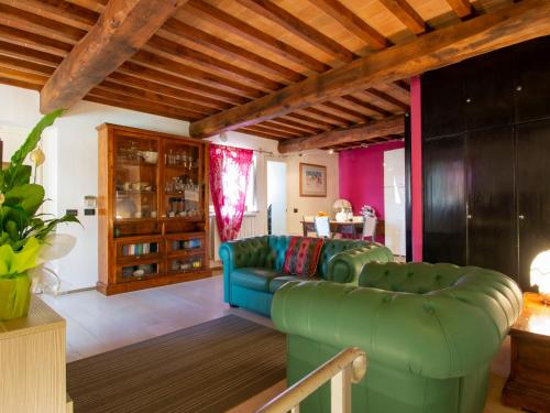 a living room with a couch and a table at Holiday Home Casa Francesca by Interhome in Rosia