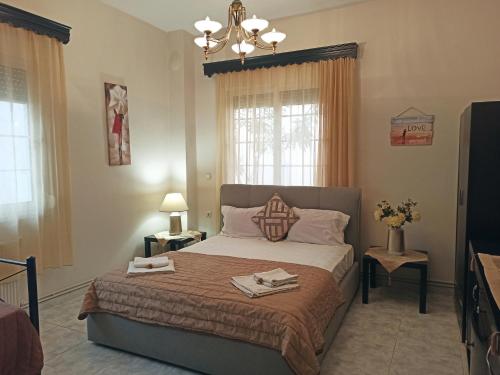 Postel nebo postele na pokoji v ubytování Villa Ekali