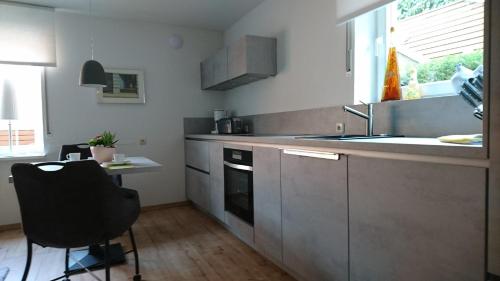 a kitchen with a sink and a counter top at Haardblick in Flaesheim