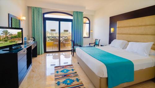 a hotel room with a bed and a television at Blend Elphistone Resort Marsa Alam in Abu Dabab