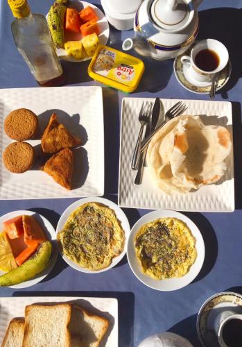 a collage of different plates of food on a table at Ella Happy View Homestay in Ella