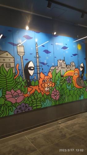 a wall with a mural of a cat and a fish at 1130 Wojciechowskiego 6A - Tanie Pokoje w Apartamencie - samodzielne zameldowanie in Poznań