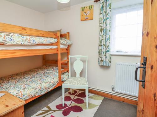 Voodi või voodid majutusasutuse Badger Cottage toas