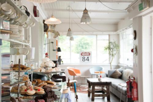 a bakery with pastries on display in a living room at MHOR 84 in Kingshouse