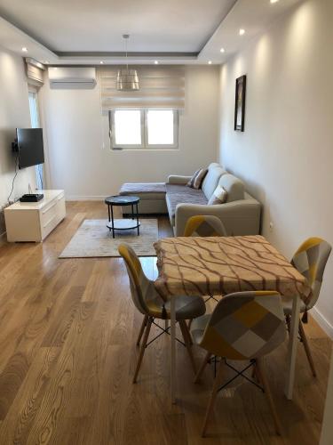 a living room with a couch and a table at M & A Apartment Bar A 29 in Bar